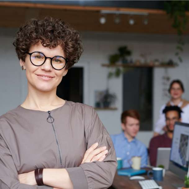 woman with arms crossed - Careers hero